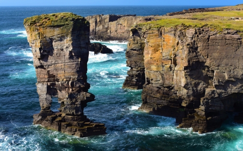 Tide washing against sea stack in Orkney