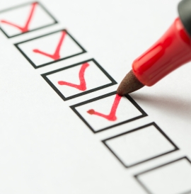 Red felt tip pen ticking boxes 
