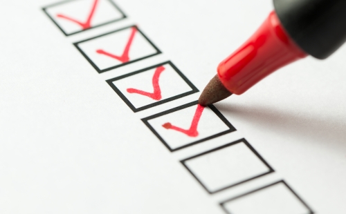 Red felt tip pen ticking boxes 