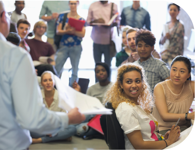 A group of students listening to a trainer